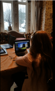 Student at table ready for online meeting