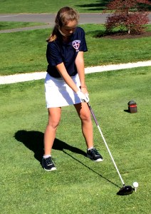 Freshman Jacqueline Munro lines up before a swing. Photo by Olivia DeNicola