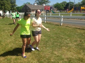 Alessandra S. and Lindsay B. compete in the three-legged race during Field Day on May 14. Photo by Alyssa Morreale. 