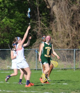 Catherine L. reaches for a catch in a game against Wardlaw-Hartridge on May 4. 