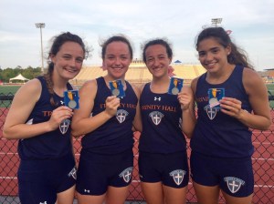 The 4x800 relay of Cate T., Caroline G., Isabelle P. and Gina R. show off their first-place medals at State Sectionals on May 22. 
